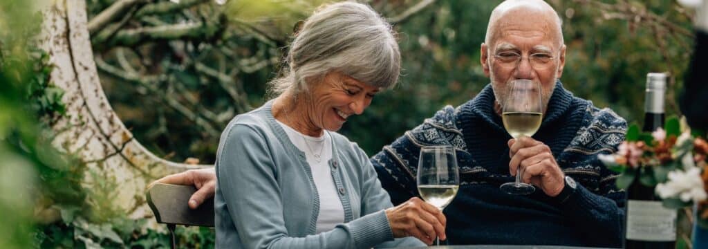 Senior couple enjoying glass of wine