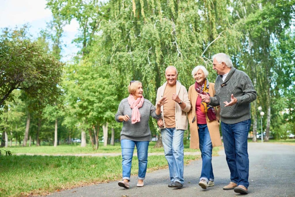 Four seniors walking